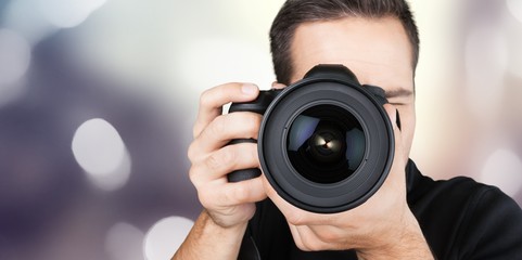 Male Photographer with Camera on  background