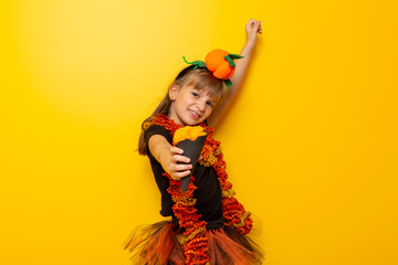 Little girl in a Halloween witch costume