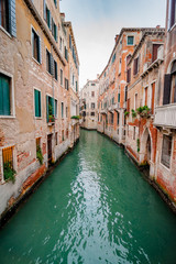 Fototapeta na wymiar Venice, Italy - 25 October, 2017: narrow old streets and famous gondola on Grand Canal.