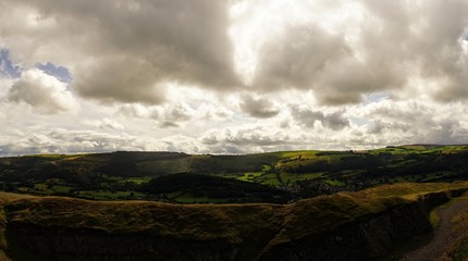 Bright Landscape of Welsh Mountains Blue Sky and White Clouds