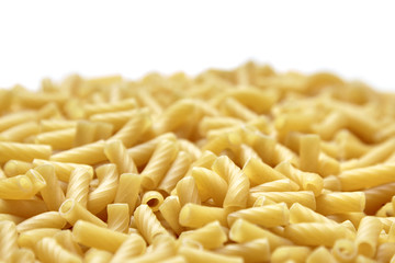 Tortiglioni italian pasta is short pasta with ribbed surface and straight cut, similar to small tubes