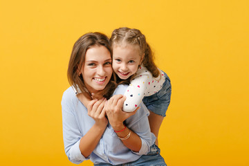 Woman in light clothes have fun with cute child baby girl 4-5 years old. Mommy little kid daughter...