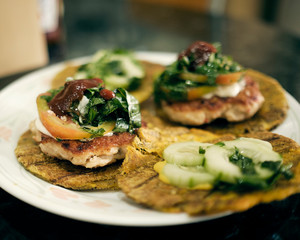 fried plantain burgers made with chicken patties and using fried plantains as buns. traditional all over the caribbean