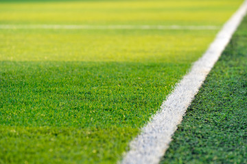 Front view of green soccer field.Beautiful artificial grass on the stadium.Abstract football turf...