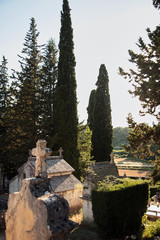 Cemetery with old stone crypts and crosses. European Christian Cemetery