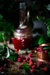 Fresh,organic raspberry in the old copper basket