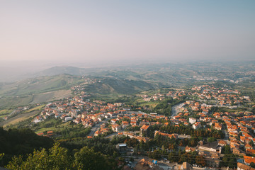 View from the top of San Marino castle. San Marino suburban districts and Italian hills view from...