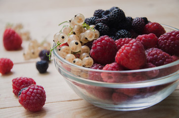 Bowl with raspberries and currants