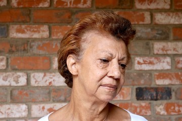 Portrait of a mature woman looking down in shame