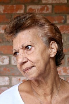 Portrait of an older woman with a serious disappointed stare