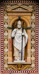 Fototapeta premium Statue of Saint Ambrose at Torre del Filarete of Sforza's castle in Milan, Italy
