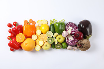 Flat lay with different vegetables and fruits on white background, copy space