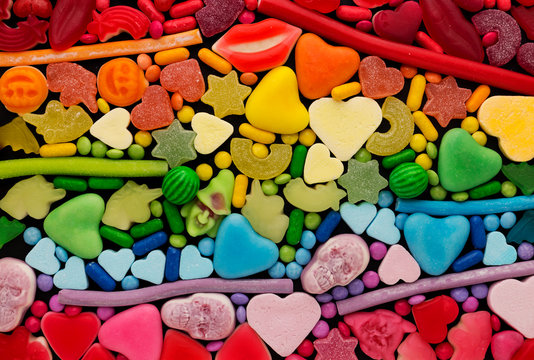 Assortment of candy ordered in rainbow colors