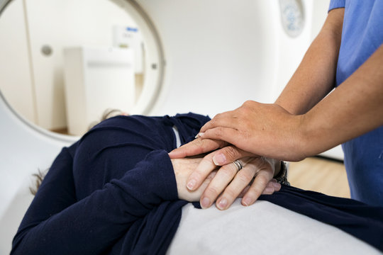 Clinic: Nurse Comforts Female Patient Before CT Scan