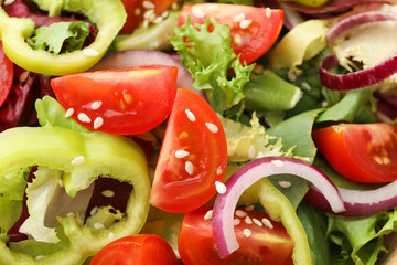 Fresh salad with sesame on whole background, close up