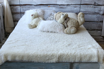 Hanging bed on chains, stylish cute bedroom interior.