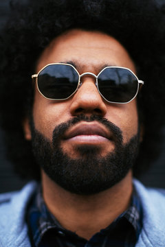 Portrait of an afro man wearing sunglasses.