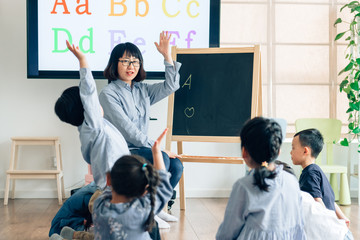 Teacher and preschool kids in classroom