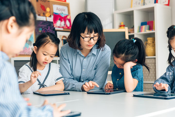 Students learning with digital tablets