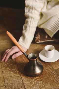 A cup of Turkish coffee, served from a cezve