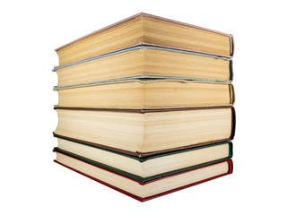 A stack of old books with yellowed pages
