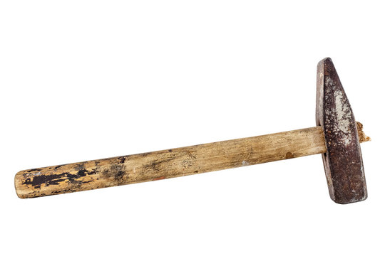 An old iron hammer with a wooden handle. Building tool