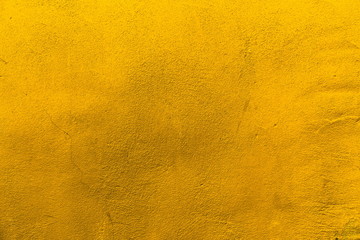 Yellow toned abstract textured background or wallpaper