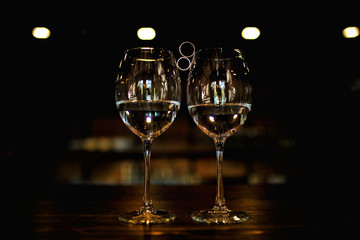  wedding gold rings are located in the center of the glasses, gold rings, wedding