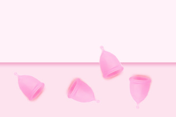 Pink menstrual cup on pink background. Flat lay, top view. copy space.