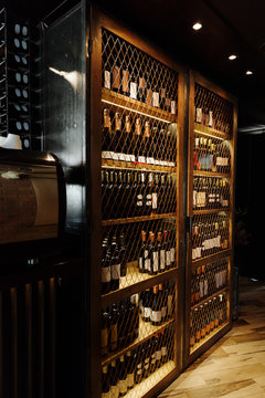 Cupboard with shelves of wine bottles