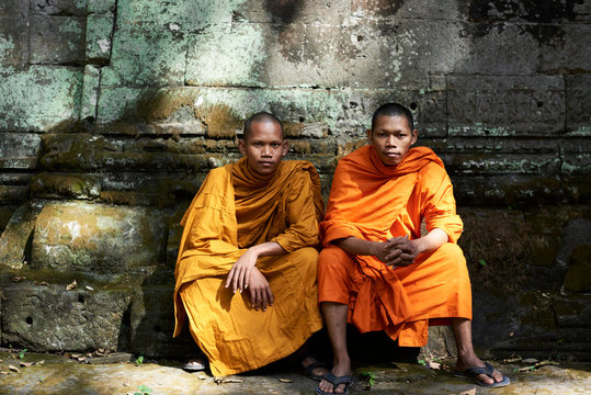 Couple of monks in orange garment.