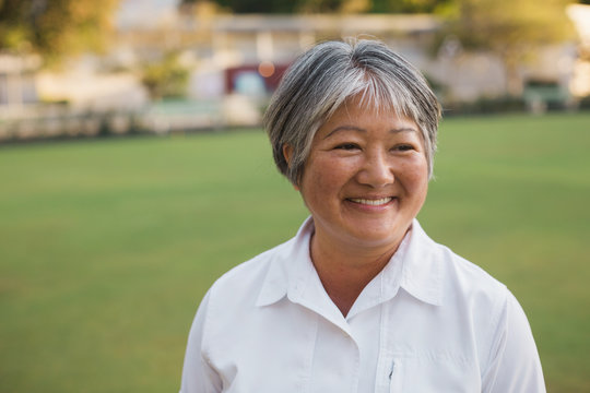 Happy senior woman lawn bowler