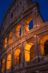 Fototapeta premium The Colosseum under the glow of lights at night, Rome