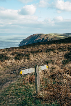 Coastal footpath and walking sign. Near Combe Martin, Devon, UK.