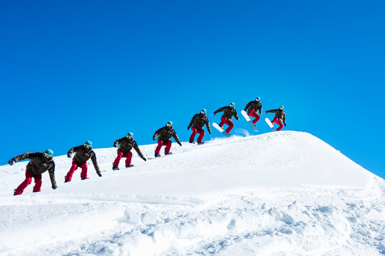 Sequence photo of a snowboarder on a ski jump