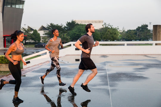 Three Runners Training in the City