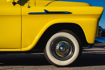 Yellow classic car. Close up of a wheel. Rock´n Roll Car