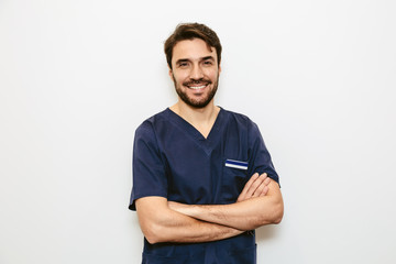 Young happy nurse looking at camera