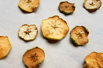 Pieces of dry apples on the table, top view
