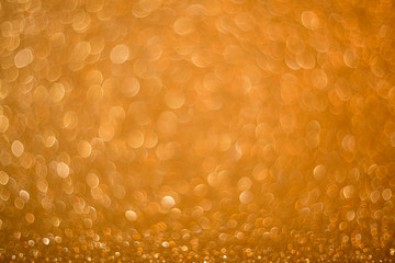 Gold giltter texture abstract background.Gold Festive Christmas twinkled bright background with bokeh defocused golden lights