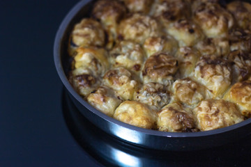 A piece of Bosnian style burek. It is a pastry filled with seasoned meat and onions and baked in an oven. Traditional Bosnian pastry- manti borek
