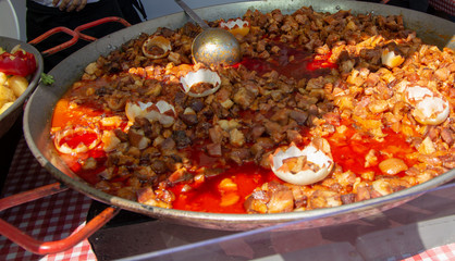 Paella in a paella dish photographed on a street food festival.