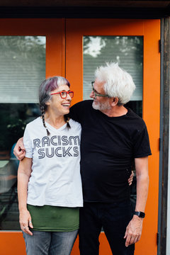 Liberal, Senior Citizen Couple In Front Of Tiny Home