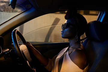 Woman driving a car on holidays.