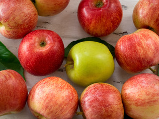 Raw red and green apples on white wooden table, top view. Flat lay, from above, close up
