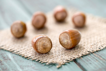 Hazelnuts and a on wooden background, christmas food