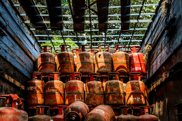 Bunch of gas cylinders , Exporting cylinders in trucks, Kolkata, West Bengal, India, Daytime, June, 2019, Summer day. - obrazy, fototapety, plakaty