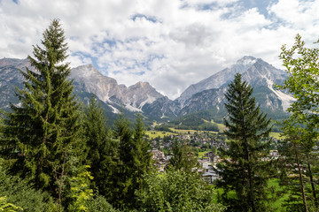 Obraz premium Panoramic mountain road / path in Italian Alps in middle of august