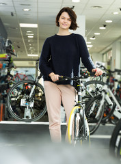 Fototapeta na wymiar female standing with bicycle