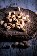 still life of isolated pistachios in the foreground in studio.